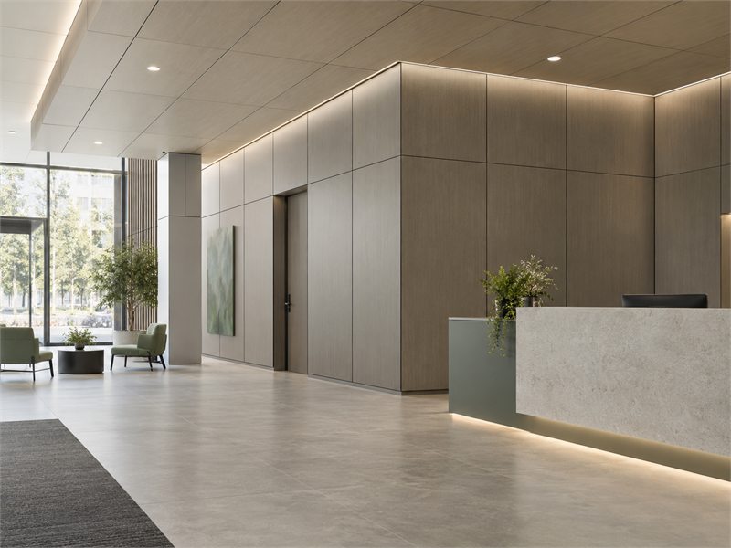 Contemporary commercial reception with durable panel furniture and integrated cabinetry
