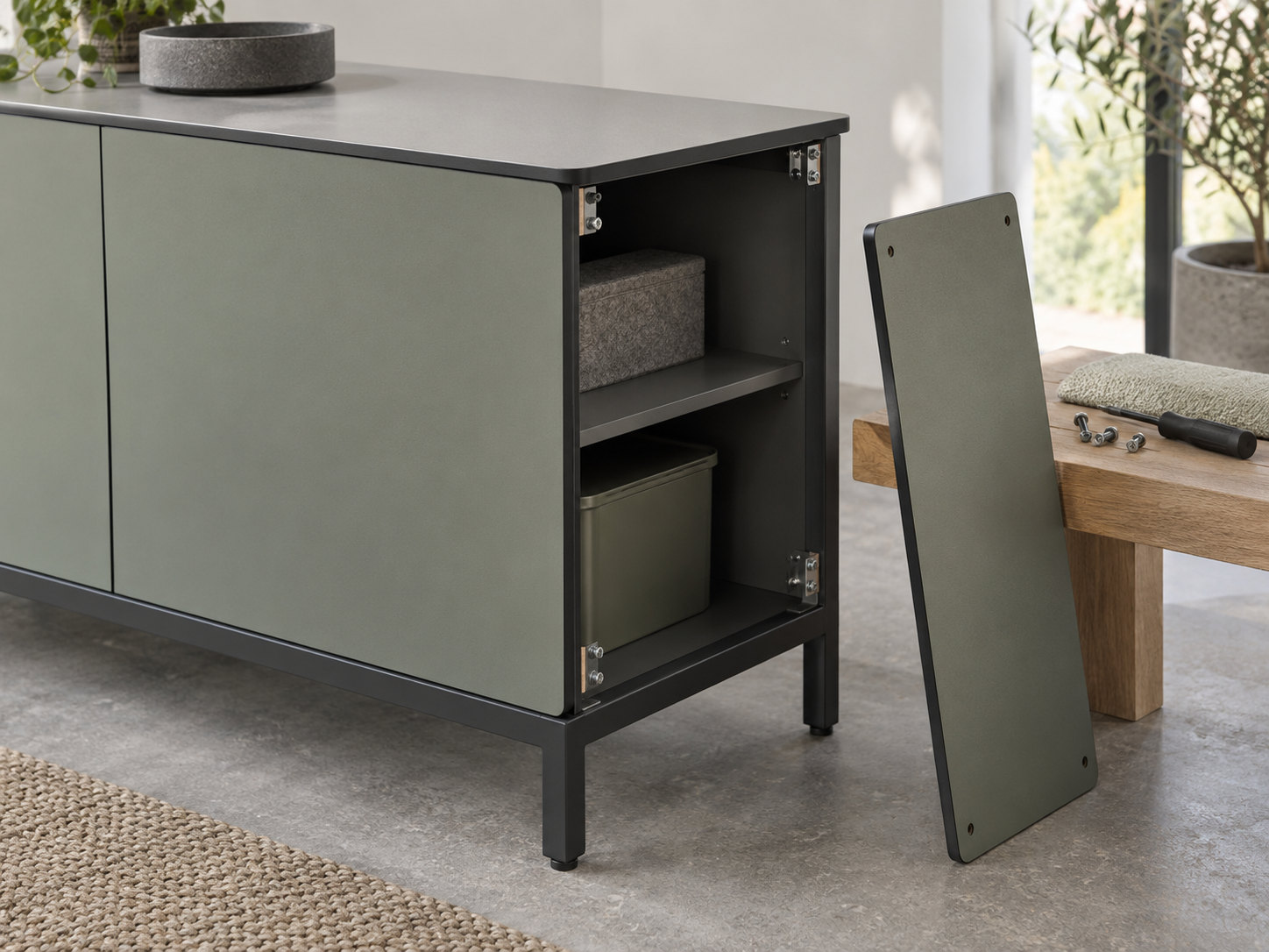 Storage module with open shelves and a separate side panel standing beside it.