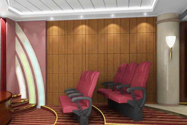 Small screening room with red tiered seats, warm patterned wall panels and a light ceiling border.