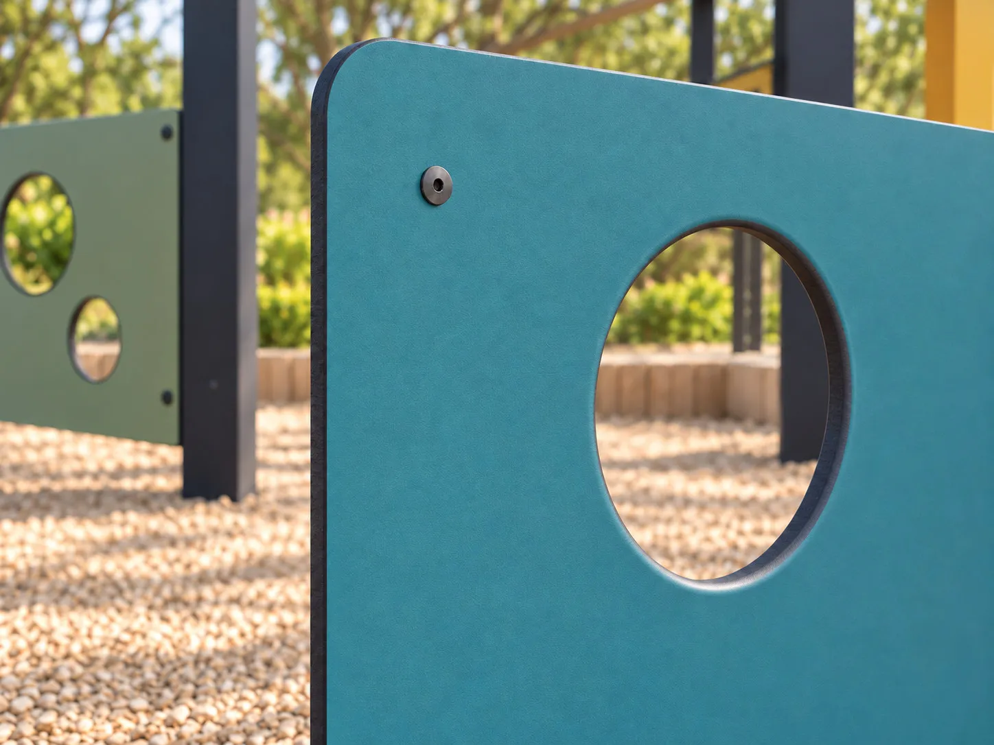 Close view of a teal panel with a rounded outer corner, thin dark exposed edge, circular opening viewed in perspective and recessed fastener.