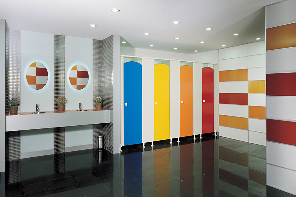 Blue, yellow, orange and red cubicle doors with curved tops.